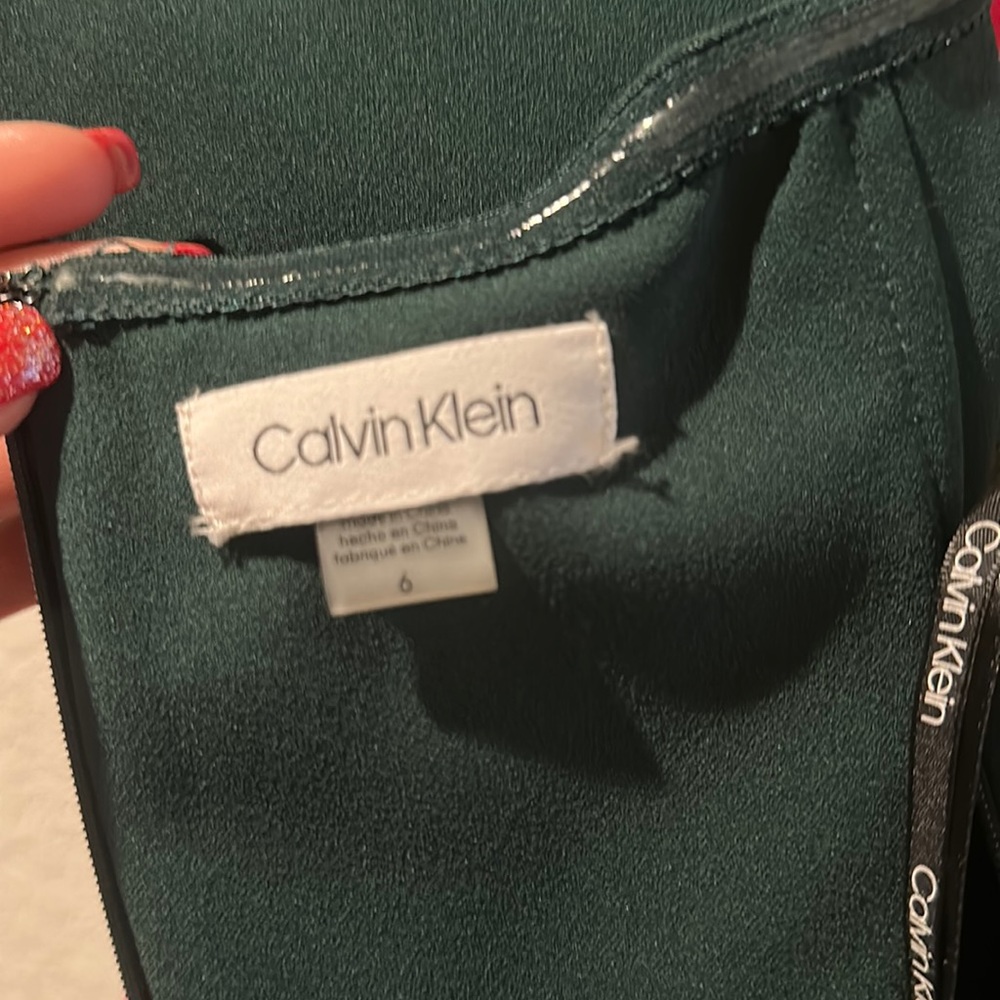 Calvin Klein elegant off shoulder mermaid evening gown.